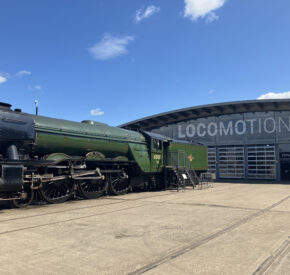 Exterior of Locomotion railway museum in Shildon, complete with a train carriage out front
