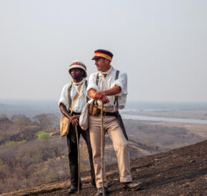 Ben Fogle and Dwayne Fields, walking wearing period kit, Zambia